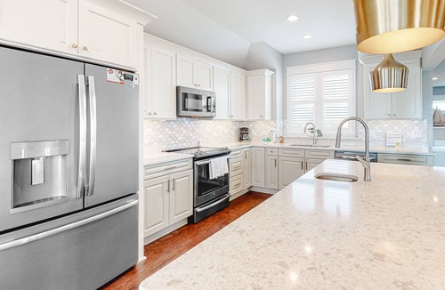Ocean Isle Estates House | Grand beach home with elevator, private hot tub, game room, & pool access