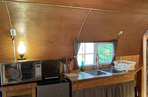 Brew Bay Cottage | Grapevine Cottage - Rustic tiny self-contained cottage and deck for single guest