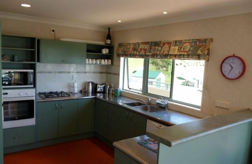 Opito Bay House | Great views, great family bach, super close to the beach and a spa pool!