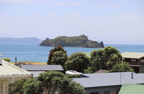 Opito Bay House | Great views, great family bach, super close to the beach and a spa pool!