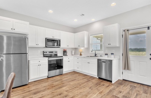 Columbus House | Green Light Haven, Comfort in Columbus, 2BR, Grill