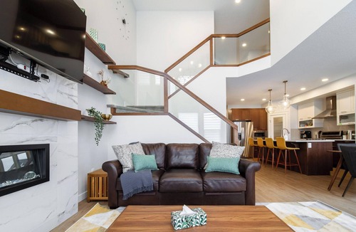 West Edmonton House | Group Oasis near WEM | Hot Tub, 2 Kitchens, 3 Lounges, Fire Table Sleeps 14