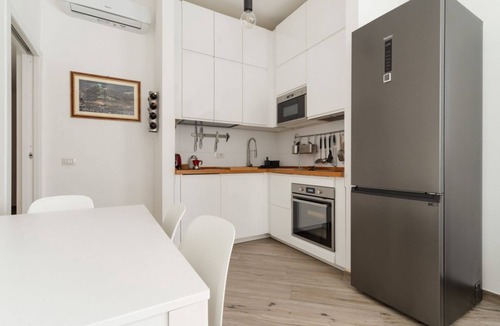 Lorenteggio Apartment | GuestHost - A comfortable and welcoming 65 square meters apartment, perfect for four people, located on the ground floor of a building.The property is strategically located: thanks to the nearby M4 metro line, guests can easily get around the city and re