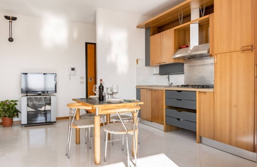Ponte San Giovanni Apartment | GuestHost - Bright 80 sqm apartment that can accommodate up to 6 people, located near the Ponte San Giovanni station. It consists of a living room with kitchen and dining area, a bathroom and two bedrooms. The flat is located on the ninth floor and has a