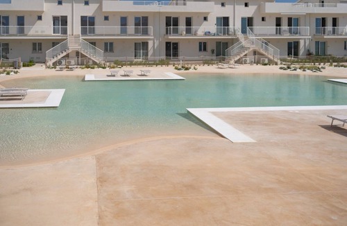 Pachino Apartment | GuestHost - Charming 75 sqm seaview apartment on two levels, for 5 people, located inside the renowned Borgo 84 residence, equipped with swimming pool and cycle path. The property is located just 3 km from the center of Marzamemi, one of the most fascina