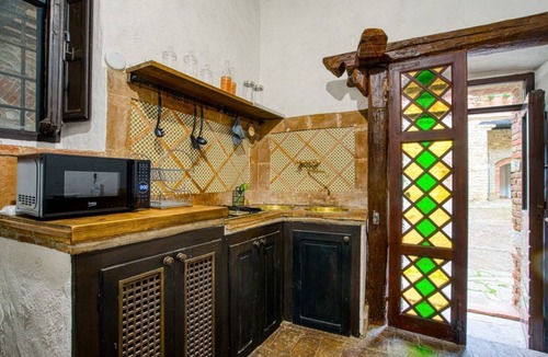 Magione Apartment | GuestHost - Comfortable apartment located in a historic Abbey from the year 1000, restored in 1980.La Badia is a small Benedictine Abbey immersed in a park of centuries-old olive trees.Located on the ground floor, there is a mezzanine for the sleeping ar