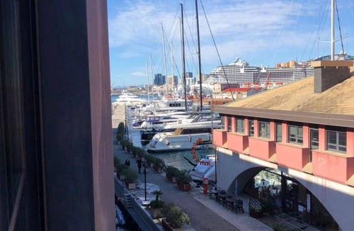 Genoa Apartment | GuestHost - Nice and bright studio apartment in the heart of the Old Port of Genoa, with large panoramic windows overlooking the dock. The apartment is only 300m from the Darsena underground and 800m from the Principe Square railway station. The Genoa Aq