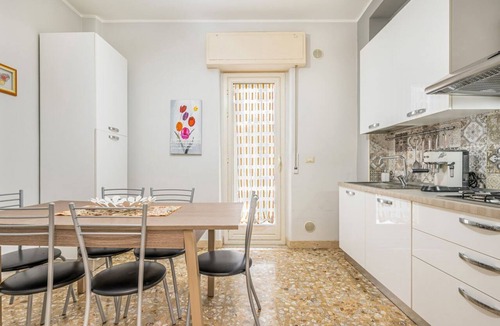 Borgo-Sanzio Apartment | GuestHost - Spacious 100 sqm apartment in Catania, ideal for 8 people, located on the second floor of a building with an elevator (not suitable for disabled individuals). The accommodation features two balconies and is near Villa Bellini, one of the city