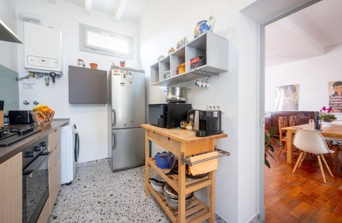 Oltretorrente Apartment | GuestHost - Spacious and bright 105 sqm apartment, accommodating up to 6 people, located on the second floor of a building without an elevator.The property is located in Parma's Oltretorrente neighborhood, a quiet residential area with plenty of amenitie