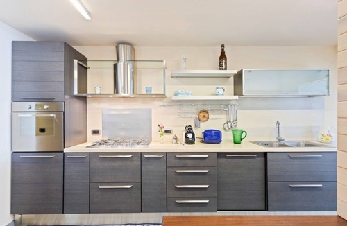 Picanello-Ognina-Barriera-Canalicchio Apartment | GuestHost - This spacious seafront 150 square meters apartment can accommodate up to 6 people. Located on the ground floor, the apartment has a garden overlooking the sea, with a stunning view and private access to the sea on a neighbors shared platform.