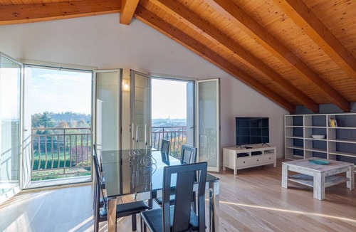 Cesana Brianza Apartment | GuestHost - Travel with your family and friends and explore lakes and mountains near Como!This large attic, with two bedrooms, two bathrooms, open space kitchen with island, large living room, terraces and patio for relaxing, is located on the road that