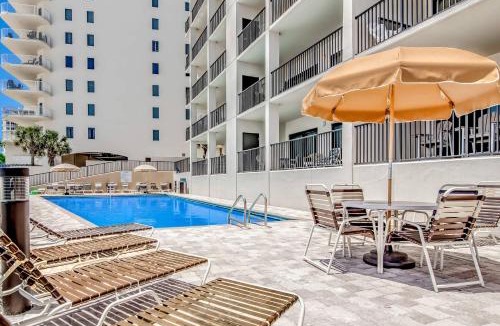 Orange Beach House | Gulf-front condo with spacious balcony resort amenities and cheerful interior