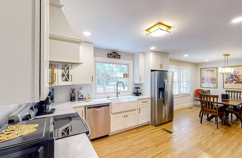 Heron Walk House | Harmonizing home with firepit, patio, deck, full kitchen, TV, and washer/dryer