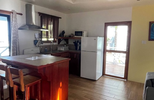 Caye Caulker Cottage | Hidden Treasure Vacation Home Bayblue Cottage Breathtaking view beautiful sunset