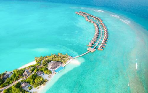 Dhonakulhi Resort | Hideaway Beach Resort & Spa - COMPLIMENTARY RETURN Shared Seaplane or Domestic Flight for two guests for a minimum of 7 nights or more for stays until 30th September 2026