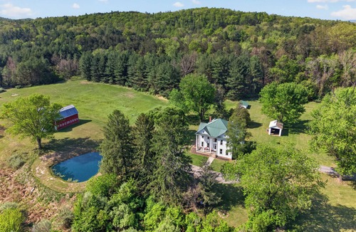 Glen Wilton House | Historic countryside farmhouse with cozy interiors, scenic views, porch, game room, and trails.