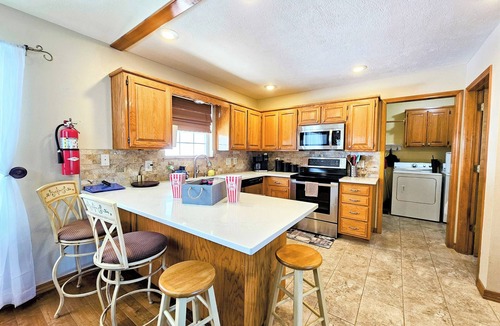 Holiday Island House | Holiday Haven On The Island! Sleeps 12! Fire pit! 6-Seater Golf Cart Included!