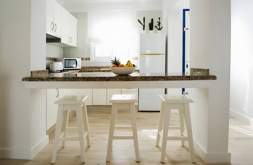 Arrieta House | Holiday Home 'Caleta Campos Bungalows' with Sea View, Shared Pool and Wi-Fi