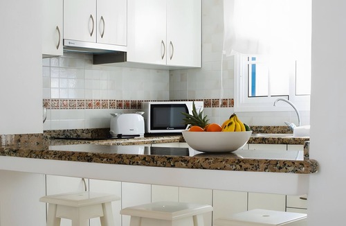 Arrieta House | Holiday Home 'Caleta Campos Bungalows' with Sea View, Shared Pool and Wi-Fi
