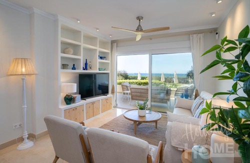 Nikki Beach Apartment | Holidays & Home Beachfront Neptuno III , sea views,and garden,Elviria