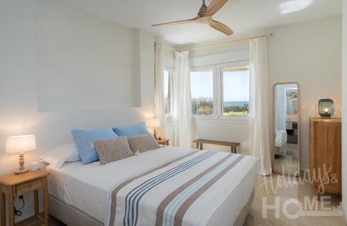 Nikki Beach Apartment | Holidays & Home Beachfront Neptuno III , sea views,and garden,Elviria