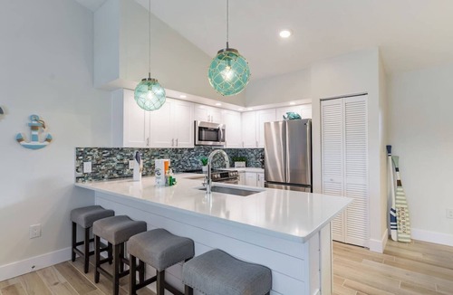 Holmes Beach House | Home with heated pool, spa, games, walk to beach