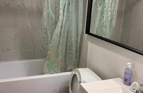Chestermere House | Homely Comfort Room. Shared washroom with One