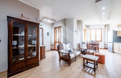 Pisa Apartment | [Homiday] Elegant apartment with wooden finishes in the central area.Relax and enjoy the three bright double bedrooms equipped with air conditioning and heating. Homiday offers the perfect accommodation for those who travel for work or leisure, in the ar