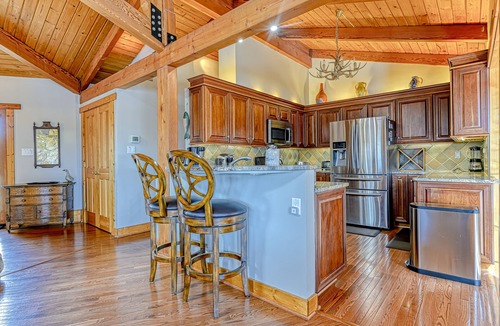 Louisa House | Huge lakefront home with A/C, sunroom, boat ramp, WIFI,game room, deck, & kayaks