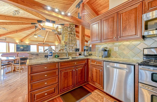 Louisa House | Huge lakefront home with A/C, sunroom, boat ramp, WIFI,game room, deck, & kayaks