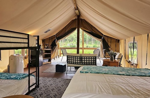 St Croix Falls RV Rental | Incredible Tented Cabin Ideal for Glamping with Fireplace and Barbecue in Saint Croix Falls, Wisconsin