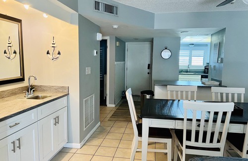 Sunny Shores Condo | Indies House Sought After Beachfront Condo w Pool near shopping and restaurants