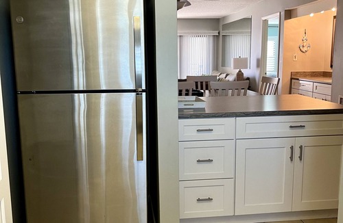 Sunny Shores Condo | Indies House Sought After Beachfront Condo w Pool near shopping and restaurants