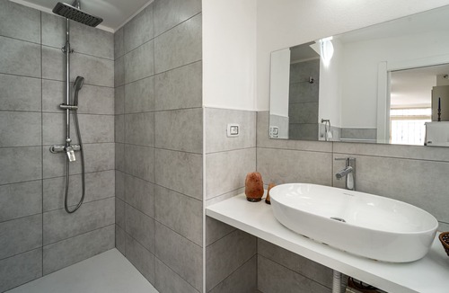 Carbonia House | Intimate, quiet studio apartment with a small living room and equipped kitchen