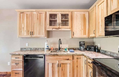 Conover House | Inviting dog-friendly cabin with hot tub, fireplace, patio, grill, central AC, & W/D