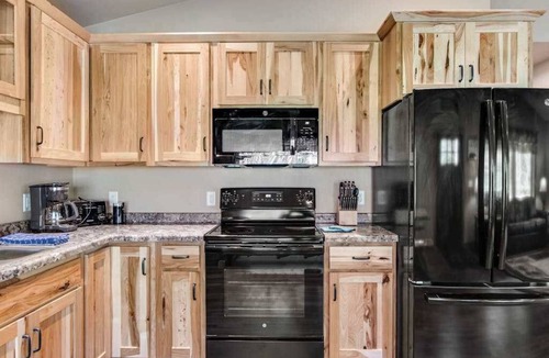 Conover House | Inviting dog-friendly cabin with hot tub, fireplace, patio, grill, central AC, & W/D