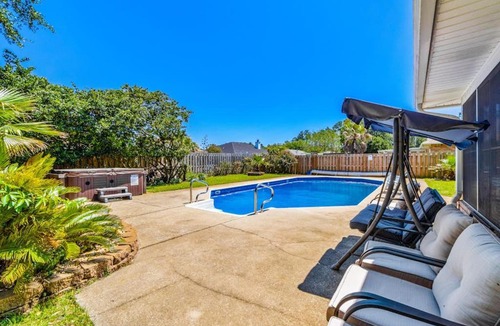 Ono Island House | Inviting dog-friendly home with pool hot tub enclosed yard & WD