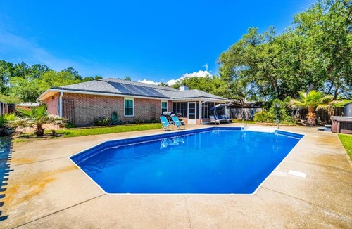 Ono Island House | Inviting dog-friendly home with pool hot tub enclosed yard & WD