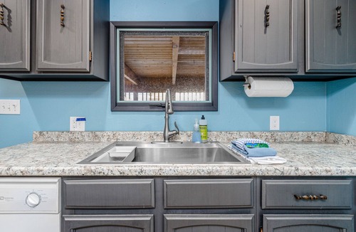Turnagain House | Inviting home with fireplace, natural light, full kitchen, W/D