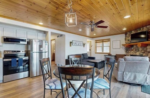 Lake Delton House | Inviting lakefront condo - amazing views, beach access, fireplace, dock, AC, W/D