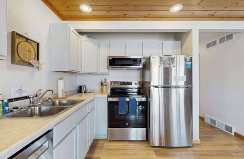 Lake Delton House | Inviting lakefront condo - amazing views, beach access, fireplace, dock, AC, W/D