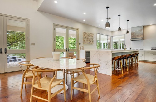 Hunt House | Inviting waterfront home with pool, patio, fireplace, W/D, & dog-friendly