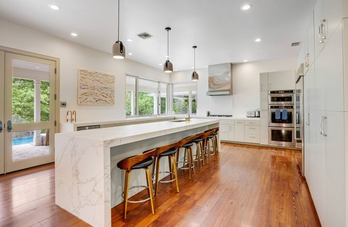 Hunt House | Inviting waterfront home with pool, patio, fireplace, W/D, & dog-friendly