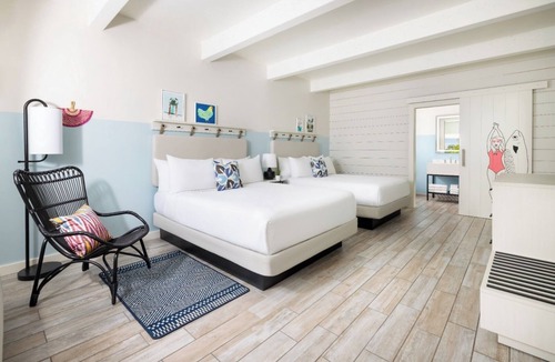 New Town Hotel | Island Charm & Retro Fun | Pools, Comfort Eats, Shuttle & Fire Pits