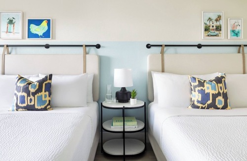 New Town Hotel | Island Charm & Retro Fun | Pools, Comfort Eats, Shuttle & Fire Pits