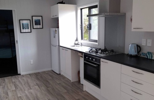 Mangonui House | Itzy Bitzy house is colourful, cosy, fully fenced with sea views