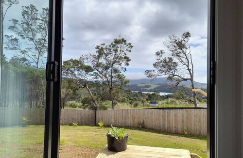Mangonui House | Itzy Bitzy house is colourful, cosy, fully fenced with sea views