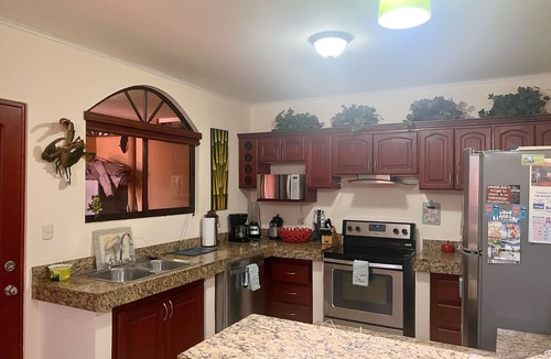 Cerro Plano House | Jaco Hideaway: 1 minute walk to direct beach access. Gated community with pool.