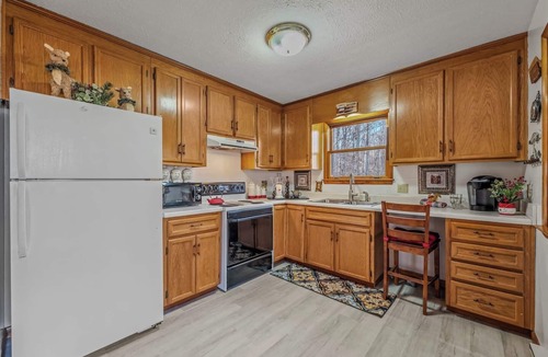 Great Cacapon Cabin | Khan River Cabin - Riverfront | Wifi | Firepit | Wood Stove | Screen Porch