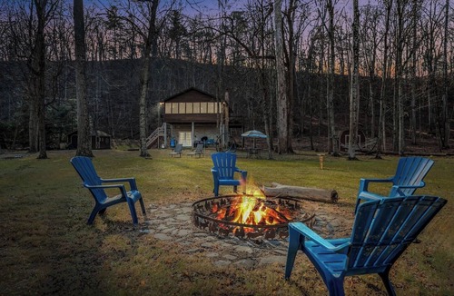 Great Cacapon Cabin | Khan River Cabin - Riverfront | Wifi | Firepit | Wood Stove | Screen Porch